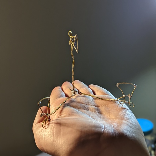 The tiny sculpture sitting in my hand.