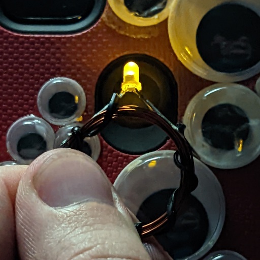 A close-up of the ring being illuminated because of a phone&rsquo;s NFC reader.
